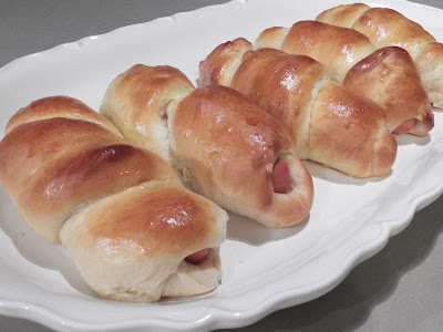 Asian Sweet Roll Pig in a Blanket, six hot dog buns, white platter, grey background