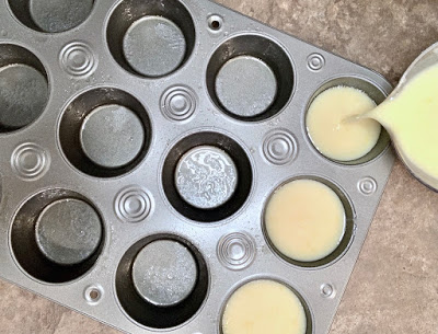 Queijadas batter pouring into cupcake pan