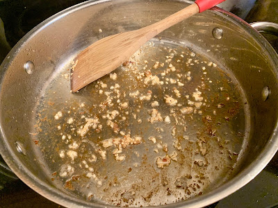 Chopped garlic cooking in a skillet
