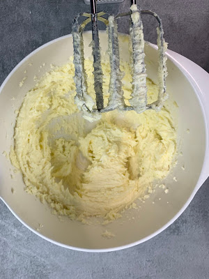 Whipped butter and sugar in a mixing bowl