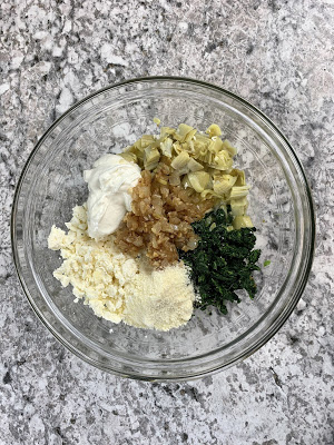 Bowl of spinach artichoke and feta tart ingredients