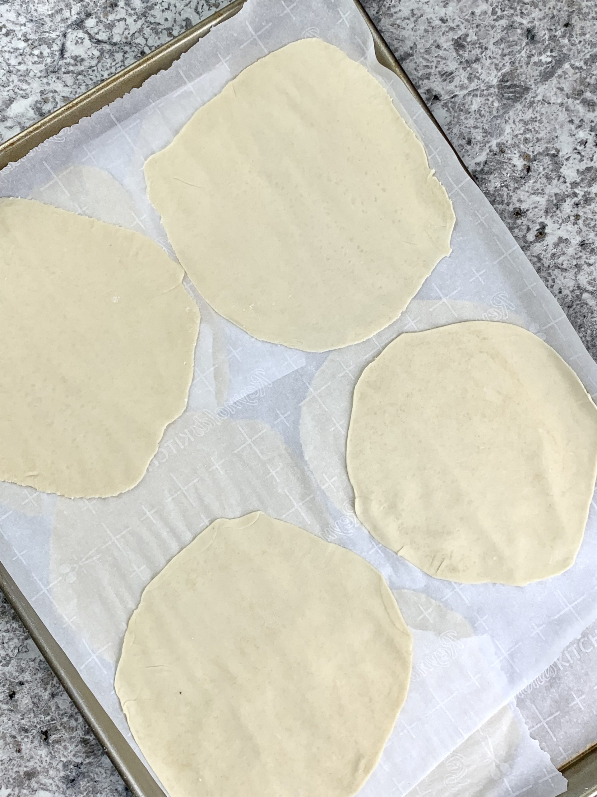 rolled out flour tortilla dough