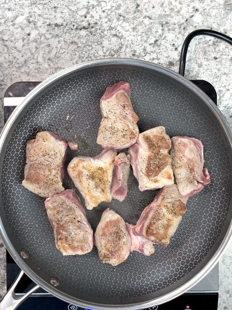 boneless pork ribs cooking in skillet