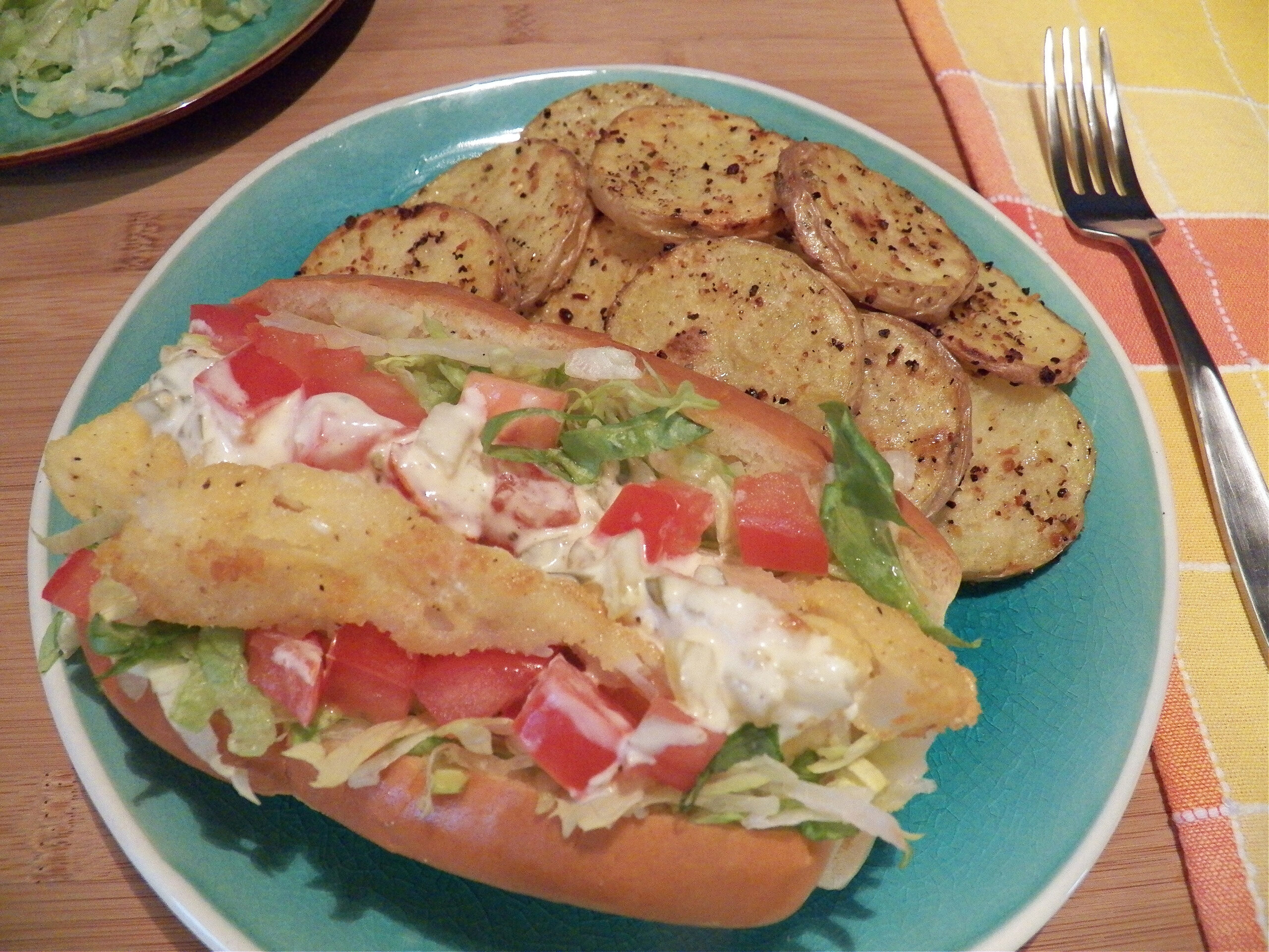 fish dog fish sandwich on a hot dog bun, top view